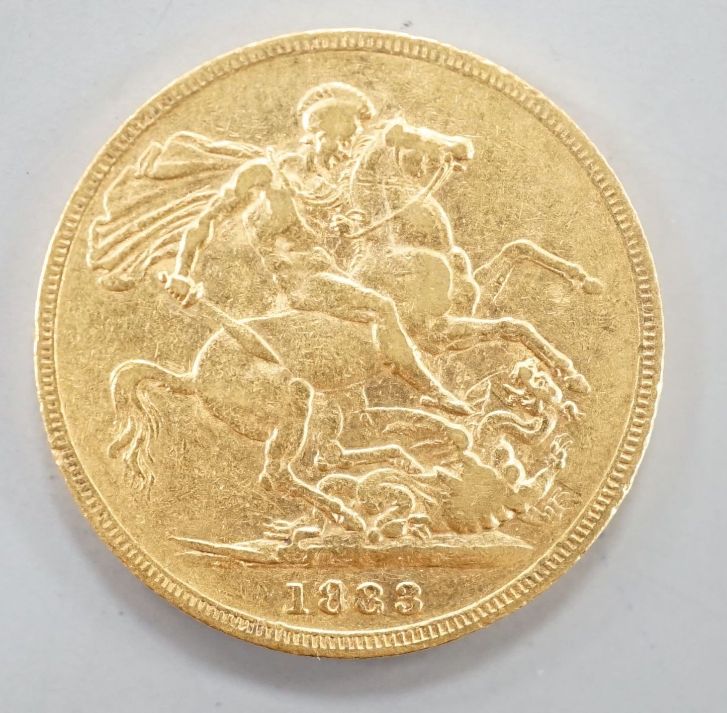 A Victoria 1883 gold sovereign.